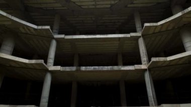 Old unfinished mall, empty space, bare concrete, aerial view. 4K aerial view