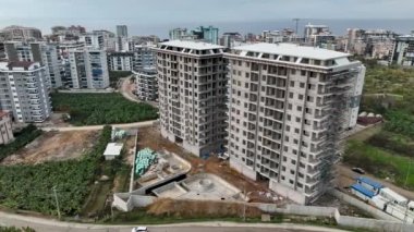 Construction site on the shores of the Mediterranean Sea, a crane lifts the metal structure 4 K