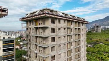 Construction site on the shores of the Mediterranean Sea, a crane lifts the metal structure 4 K