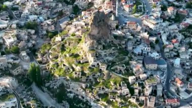 known for its distinctive fairy chimneys tall, cone shaped rock formations clustered in Monks Valley, Goreme and elsewhere.