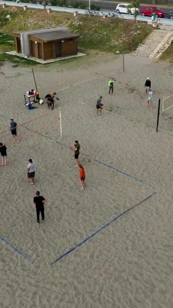 Immerse Yourself Serene Coastal Ambiance People Walk Sit Play Volleyball — Stock Video