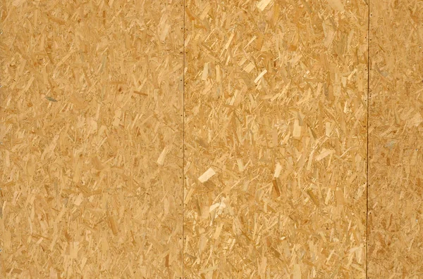 stock image OSB texture Chipboard sheet can be used as a background. Construction concept, fresh renovation, temporary or regular building materials