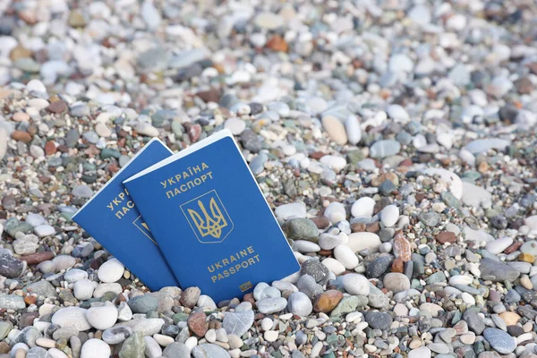 stock image New biometric Ukrainian passport let you travel to European resort countries of European Union without visas. Visa free electronic id document. Ukrainians get new interntational passports