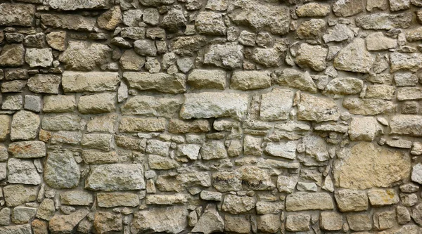 石墙的结构 有许多褐色和灰色的大石头 配有水泥 古堡石墙纹理背景 中世纪使用 作为背景的石头建筑的一部分 — 图库照片