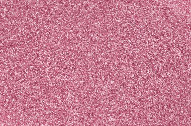 Pembe dekoratif pullar. 2023 yılının rengi olan Viva Magenta 'nın ışık tonunu yansıtan küçük elementlerin parlak bokeh ışıkları ile arkaplan görüntüsü