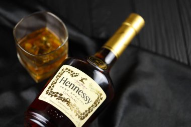 KYIV, UKRAINE - MAY 4, 2022 Hennessy Very Special original alcohol bottle on black wooden table. Elite alcohol production
