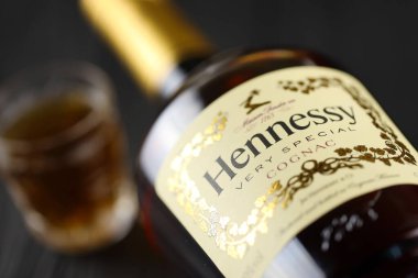 KYIV, UKRAINE - MAY 4, 2022 Hennessy Very Special original alcohol bottle on black wooden table. Elite alcohol production