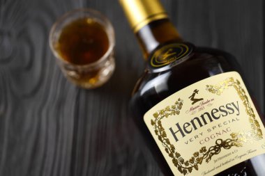 KYIV, UKRAINE - MAY 4, 2022 Hennessy Very Special original alcohol bottle on black wooden table. Elite alcohol production