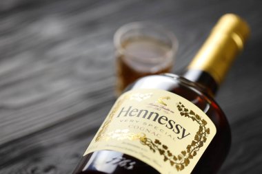 KYIV, UKRAINE - MAY 4, 2022 Hennessy Very Special original alcohol bottle on black wooden table. Elite alcohol production