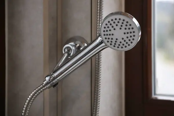 stock image Silvery shower in modern hotel bathroom with natural light from window