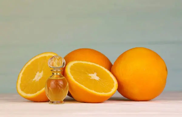Oil essence bottle with citrus extracts. Selective focus. Spa day, concept of freshness oil bottle with lemon lime and orange extract