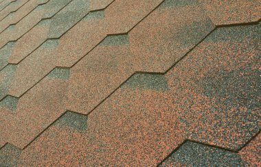 Çatı ile Bitümlü kat doku. Kaba Bitümlü mozaik kırmızı ve kahverengi çiçek. Çatı su geçirmez