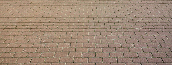 A large area, covered with a quality paving stone in daylight