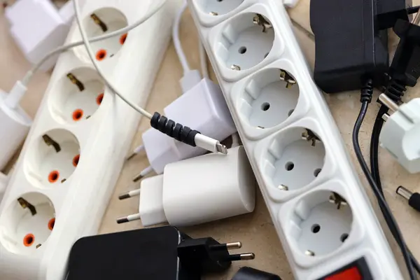 Many electrical plugs network congestion. The concept of electrical dependence. Lots of power plugs near power outlets