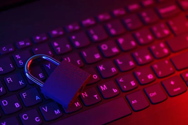 stock image Computer security concept with a closed padlock on the keyboard. Padlock on top of a laptop keyboard. Selective focus Toned image