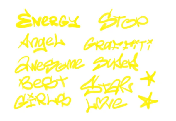 Collection of graffiti street art tags with words and symbols in yellow color on white background