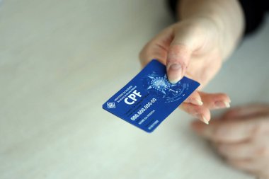 KYIV, UKRAINE - 31 Ekim 2023 Blue CPF kart şablonu. Belge, Brezilya 'daki insanlar arasındaki elektronik iletişimin gerçekliğini ve bütünlüğünü garanti ediyor. Kadastro de Pessoa Fisica