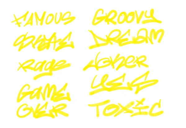 Collection of graffiti street art tags with words and symbols in yellow color on white background