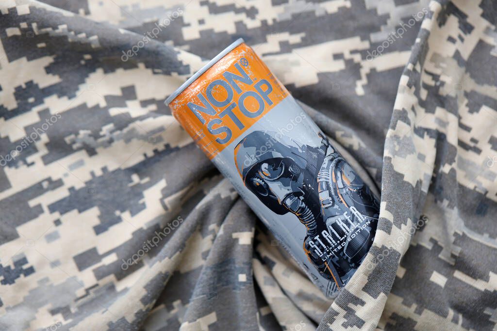 KYIV, UKRAINE - OCTOBER 31, 2023 Non Stop energy drink with limited edition design of Stalker and character with gas mask on aluminium tin can close up
