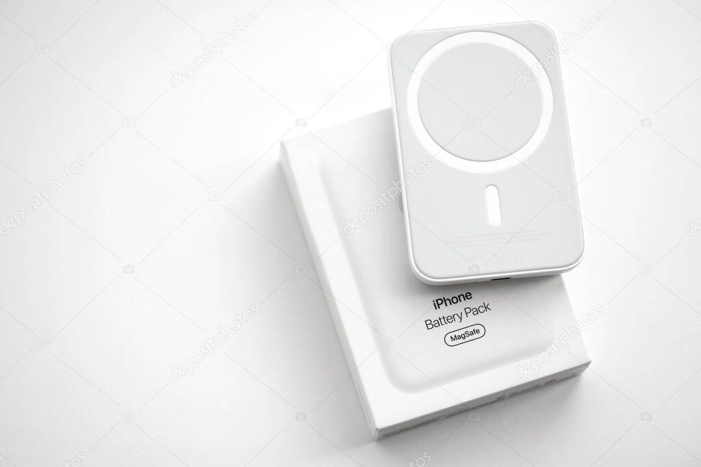 KYIV, UKRAINE - OCTOBER 31, 2023 Apple MagSafe battery device for iPhone charging via magnet connection. Mag Safe modern portable power bank device