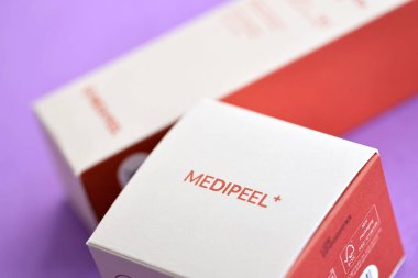 KYIV, UKRAINE - NOVEMBER 27, 2023 Hyatt Kombucha face skin tea-tox cream and toner bottle of Medipeel brand close up clipart