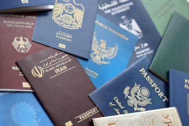 Many various passports of citizens of different countries and regions of the world close up clipart