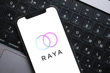 KYIV, UKRAINE - FEBRUARY 23, 2024 Raya logo of famous dating website or app on iPhone display screen close up clipart