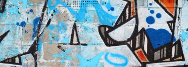 Duvarında parlak aerosol çizgileri olan grafiti resimlerinin renkli arka planı. Eski moda sokak sanatı sprey boya kutularından yapılmış. Çağdaş gençlik kültürü arka planı