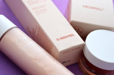 KYIV, UKRAINE - NOVEMBER 27, 2023 Hyatt Kombucha face skin tea-tox cream and toner bottle of Medipeel brand close up clipart