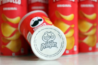 KYIV, UKRAINE - FEBRUARY 27, 2024 Pringles original potato chips on white background. Pringles is a brand of potato snack chips owned by the Kellogg Company clipart