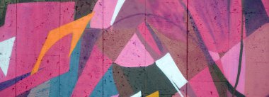 Duvarında parlak aerosol çizgileri olan grafiti resimlerinin renkli arka planı. Eski moda sokak sanatı sprey boya kutularından yapılmış. Çağdaş gençlik kültürü arka planı
