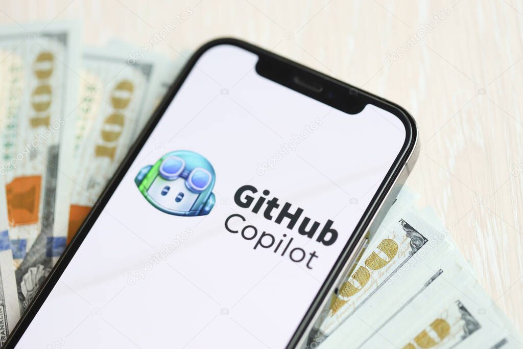 KYIV, UKRAINE - MARCH 17, 2024 Github copilot logo on iPhone display screen with many hundred dollar bills. Artificial Intelligence engine