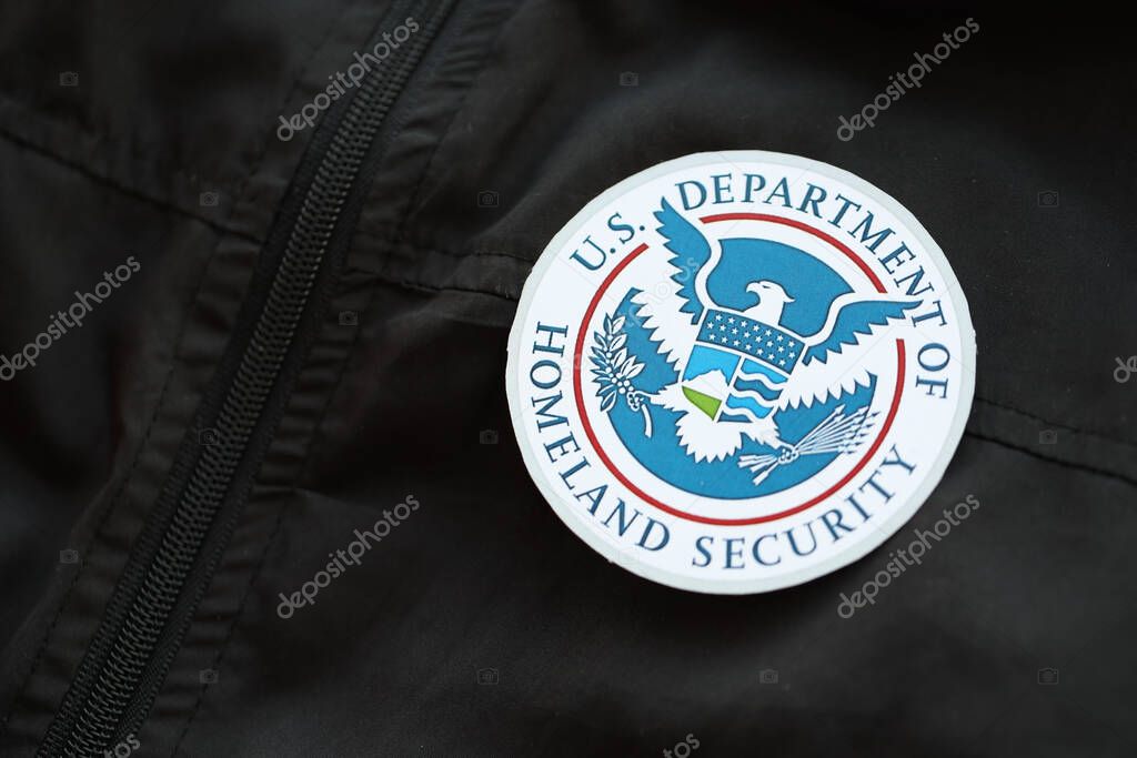 KYIV, UKRAINE - MARCH 9, 2024 US Department of Homeland Security seal on black jacket uniform close up