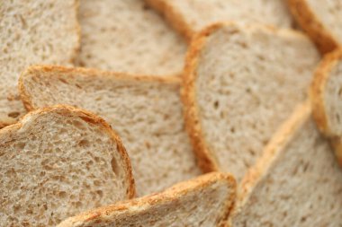 Tam kare makro fotoğraflı taze dilimlenmiş ekmek. Yakın çekim.