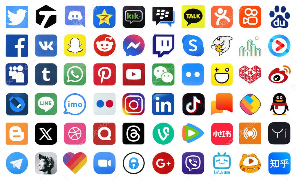 KYIV, UKRAINE - APRIL 1, 2024 Many icons of social media, messengers, video sharing platforms and other popular services and websites printed on white paper