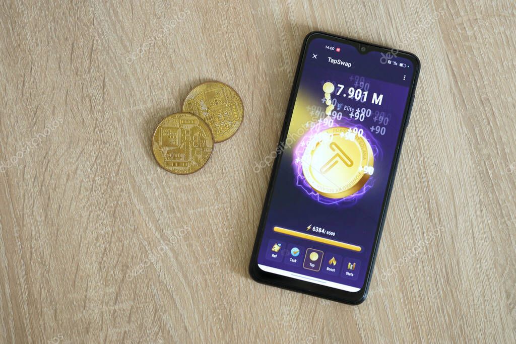 KYIV, UKRAINE - APRIL 20, 2024 Tap Swap telegram bot on smartphone screen. Tap Swap is a viral Telegram based crypto game for earn tokens by managing a virtual crypto exchange
