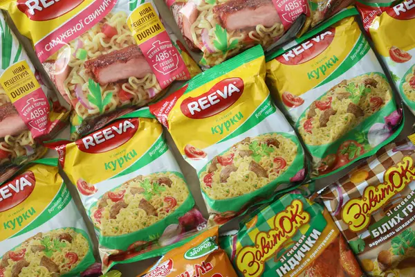 Stock image KYIV, UKRAINE - APRIL 20, 2024 Many packs of instant noodles for fast cooking by various brands and manufacturers close up