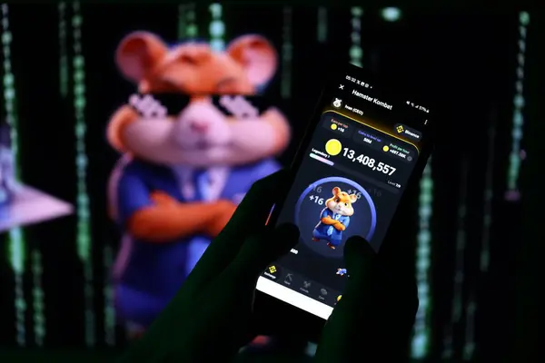 stock image KYIV, UKRAINE - APRIL 20, 2024 Hamster Kombat telegram bot on smartphone screen. Hamster Kombat is a viral Telegram-based crypto game for earn HMSTR tokens by managing a virtual crypto exchange