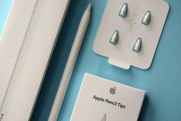 stock image KYIV, UKRAINE - APRIL 20, 2024 Apple pencil tips for special apple pencil for drawing on iPad tablet close up on blue background