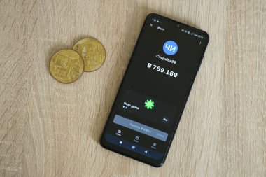 KYIV, UKRAINE - APRIL 20, 2024 Blum telegram bot on smartphone screen. Blum is a viral Telegram based crypto game for earn tokens by managing a virtual crypto exchange clipart