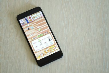 KYIV, UKRAINE - 20 Nisan 2024 Catizen telgraf robotu akıllı telefon ekranında. Catizen sanal bir şifreleme işleterek hatıra kazanmak için kullanılan bir viral Telegram tabanlı şifreli oyunudur.