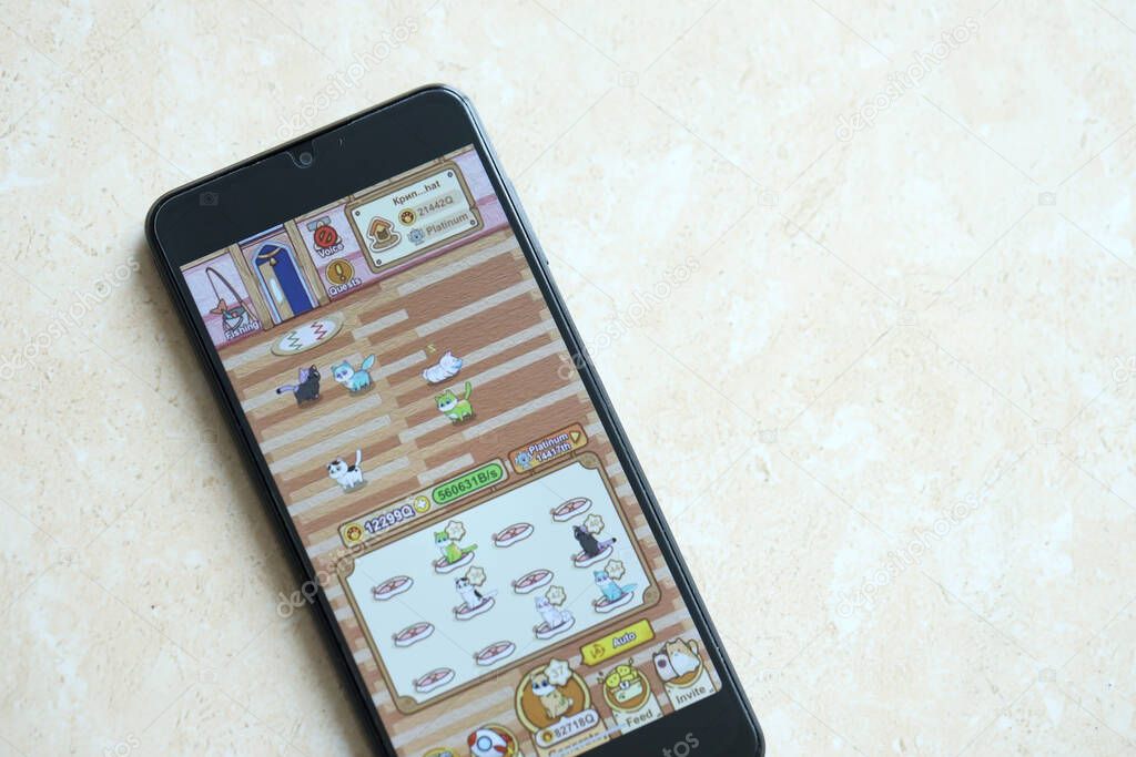 KYIV, UKRAINE - APRIL 20, 2024 Catizen telegram bot on smartphone screen. Catizen is a viral Telegram based crypto game for earn tokens by managing a virtual crypto exchange