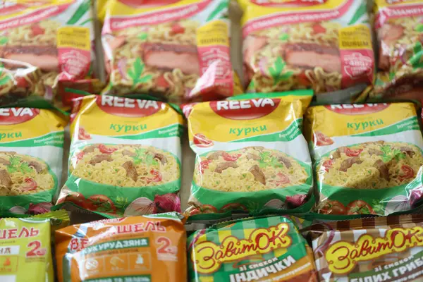 stock image KYIV, UKRAINE - APRIL 20, 2024 Many packs of instant noodles for fast cooking by various brands and manufacturers close up