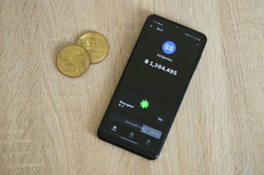KYIV, UKRAINE - APRIL 20, 2024 Blum telegram bot on smartphone screen. Blum is a viral Telegram based crypto game for earn tokens by managing a virtual crypto exchange clipart