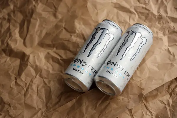 stock image KYIV, UKRAINE - APRIL 20, 2024 Can of Monster Energy Drink ultra on paper background. Introduced in 2002 Monster now has over 30 different drinks with high a caffeine content
