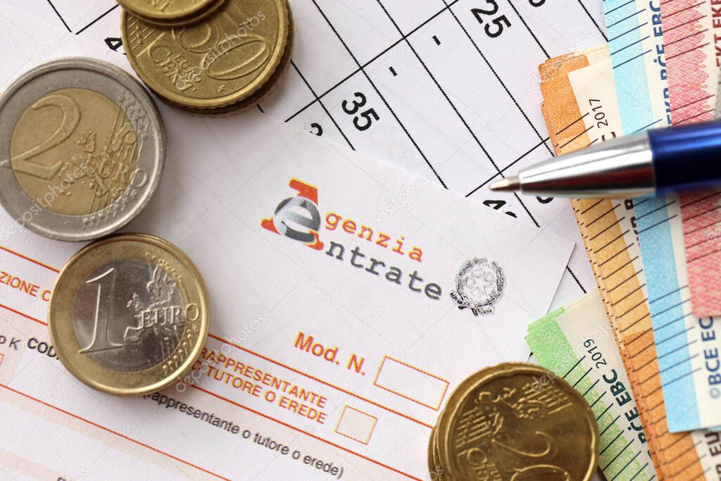 KYIV, UKRAINE - APRIL 20, 2024 Agenzia Entrate logo from blank tax form and many euro banknotes on office table and pen