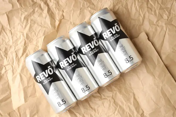 Stock image KYIV, UKRAINE - APRIL 20, 2024 Cans of Revo alco energy drink in new design with logo in black star close up