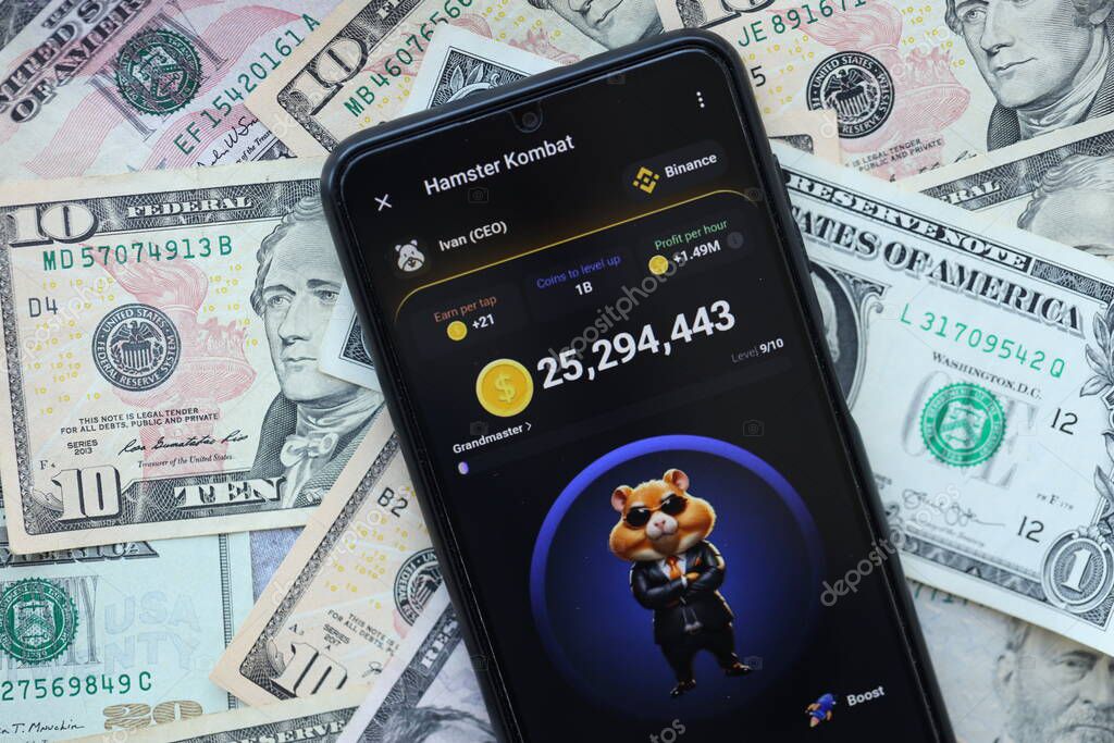KYIV, UKRAINE - JUNE 20, 2024 Hamster Kombat tap 2 earn mini game in telegram messenger on smartphone display close up