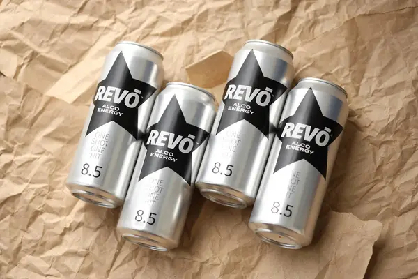 stock image KYIV, UKRAINE - APRIL 20, 2024 Cans of Revo alco energy drink in new design with logo in black star close up