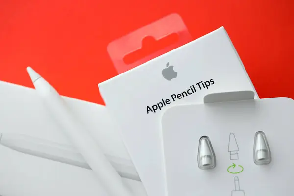 stock image KYIV, UKRAINE - APRIL 20, 2024 Apple pencil tips for special apple pencil for drawing on iPad tablet close up on red background